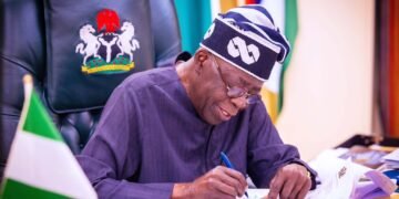 President Bola Tinubu signing the executive order ending NNPC’s 30% oil revenue cuts.