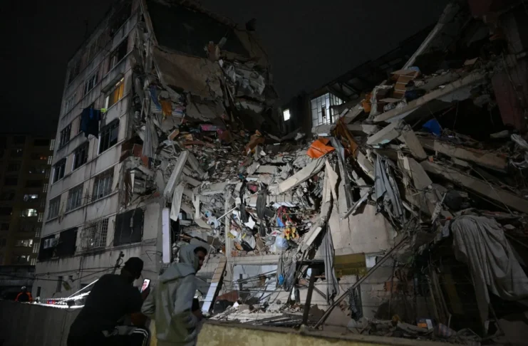 Rescuers search through rubble after a powerful earthquake in Colombia