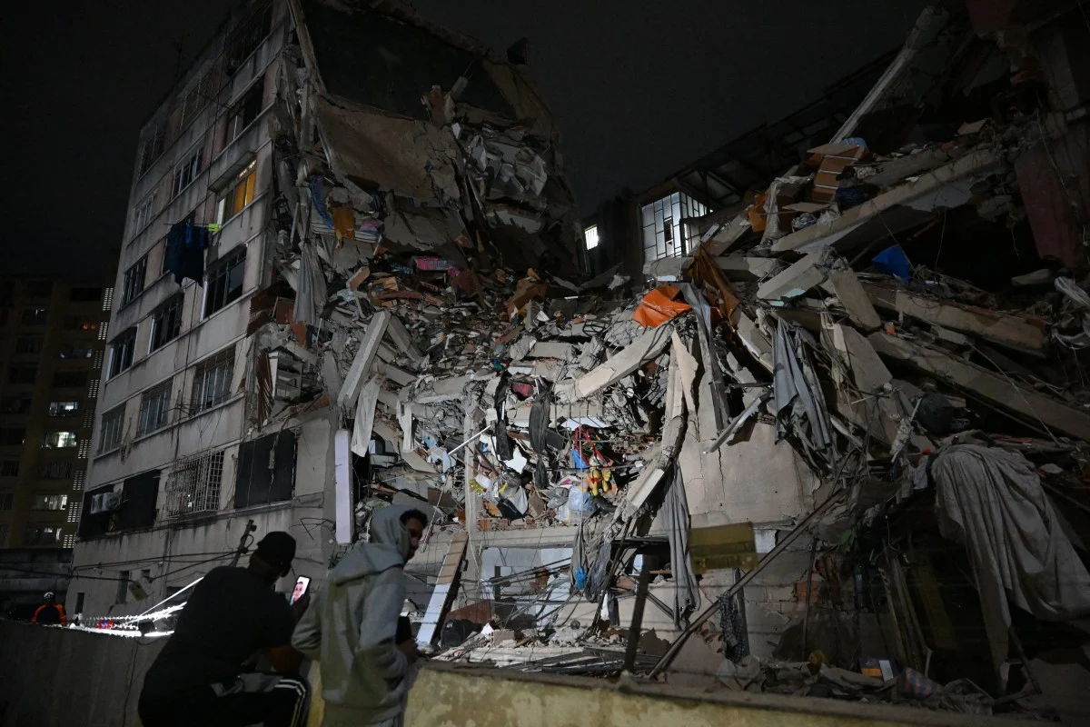 Colombia Earthquake: Death Toll Rises To 132 As Rescuers Search For Survivors Rescuers search through rubble after a powerful earthquake in Colombia